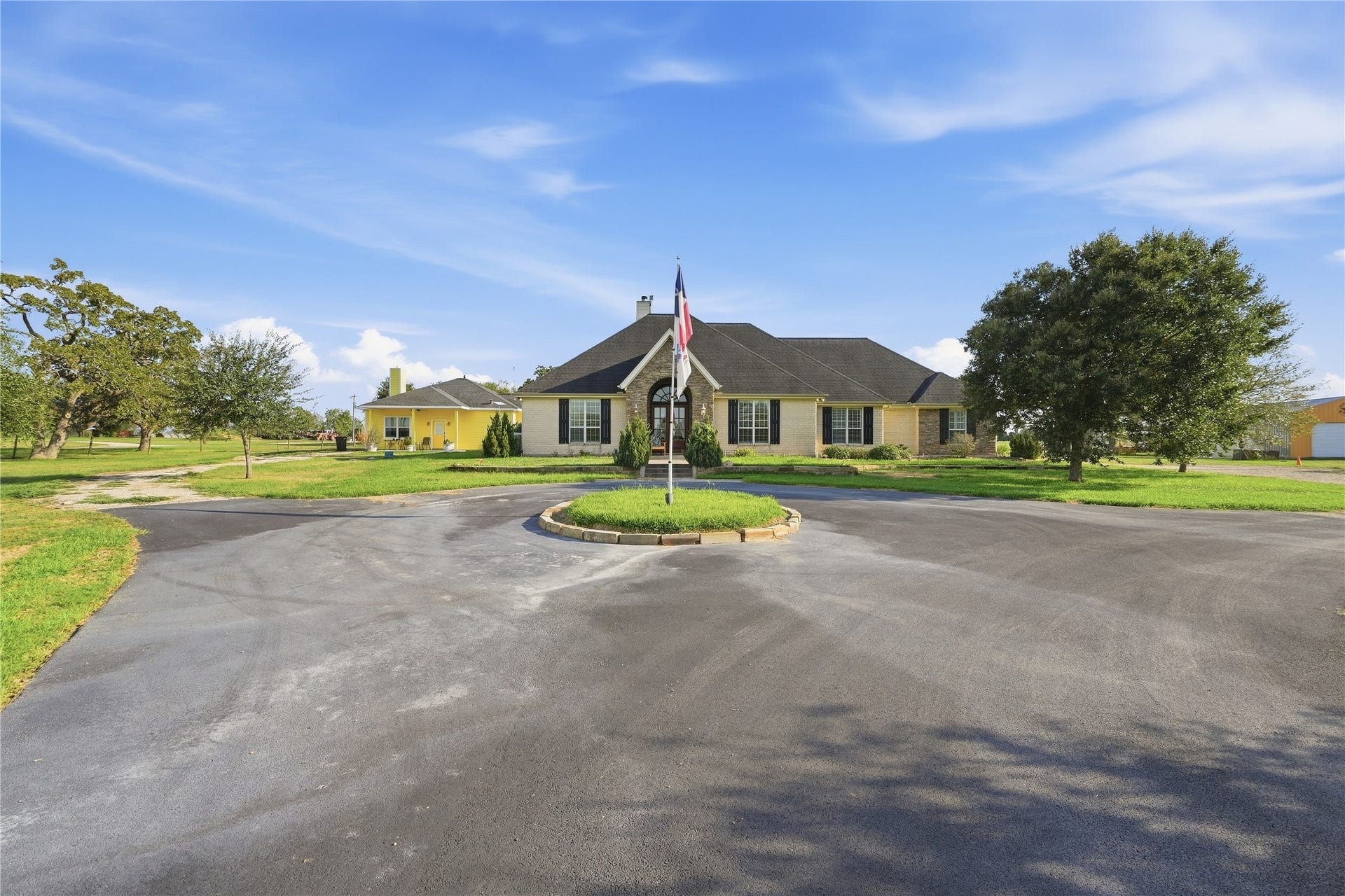 29101 Fm 1736 Road, Hempstead, TX 77445 PRIVATE DRIVEWAY LEADING UP TO THE MAIN HOUSE WITH GUEST HOUSE IN THE BACKGROUND (LEFT) AND MASSIVE SHOP AND RV STORAGE ON THE RIGHT.