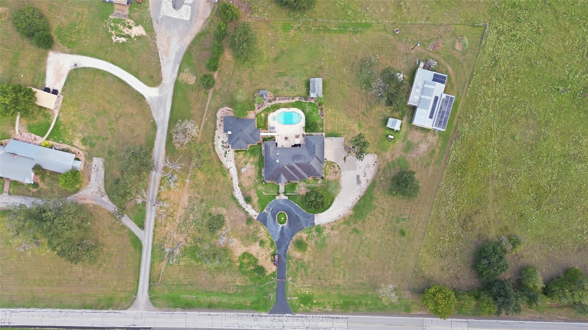 29101 Fm 1736 Road, Hempstead, TX 77445 ARIAL VIEW OF THE PROPERTY WHERE THE SOLAR SYSTEM WITH BACK-UP BATTERY HIDDEN ON TOP OF THE SHOP CAN BE SEEN (TOP RIGHT CORNER)