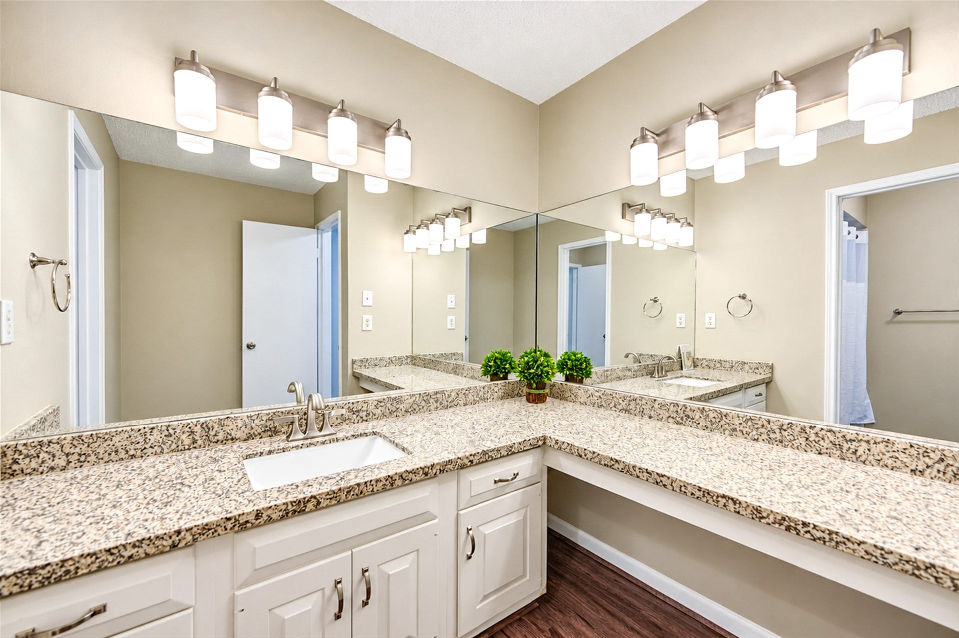 361 Champions Colony III, Houston, TX 77069 Spacious bathroom featuring dual sinks with elegant granite countertops, ample under-sink storage, and bright vanity lighting.