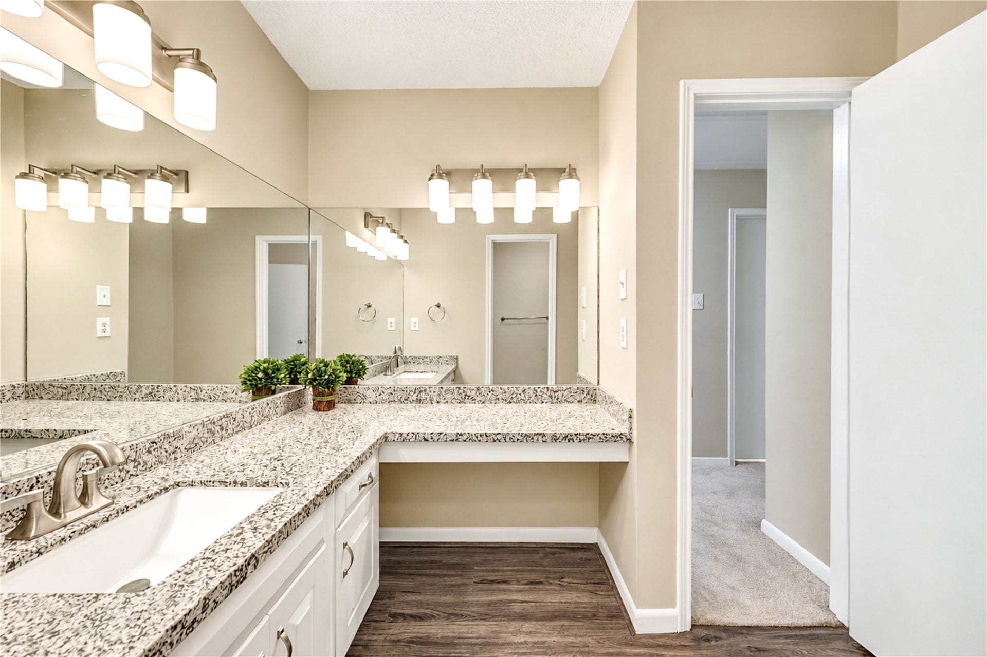 361 Champions Colony III, Houston, TX 77069 Elegant secondary bathroom featuring a granite countertop with dual sinks, stylish lighting fixtures, and ample storage in a serene, neutral color palette.