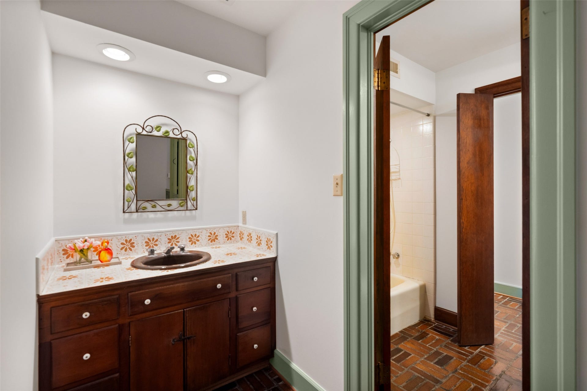 38914 Sampson Road, Brookshire, TX 77423 A charming Jack-and-Jill bath where each vanity brings its own personality and character to the shared space.