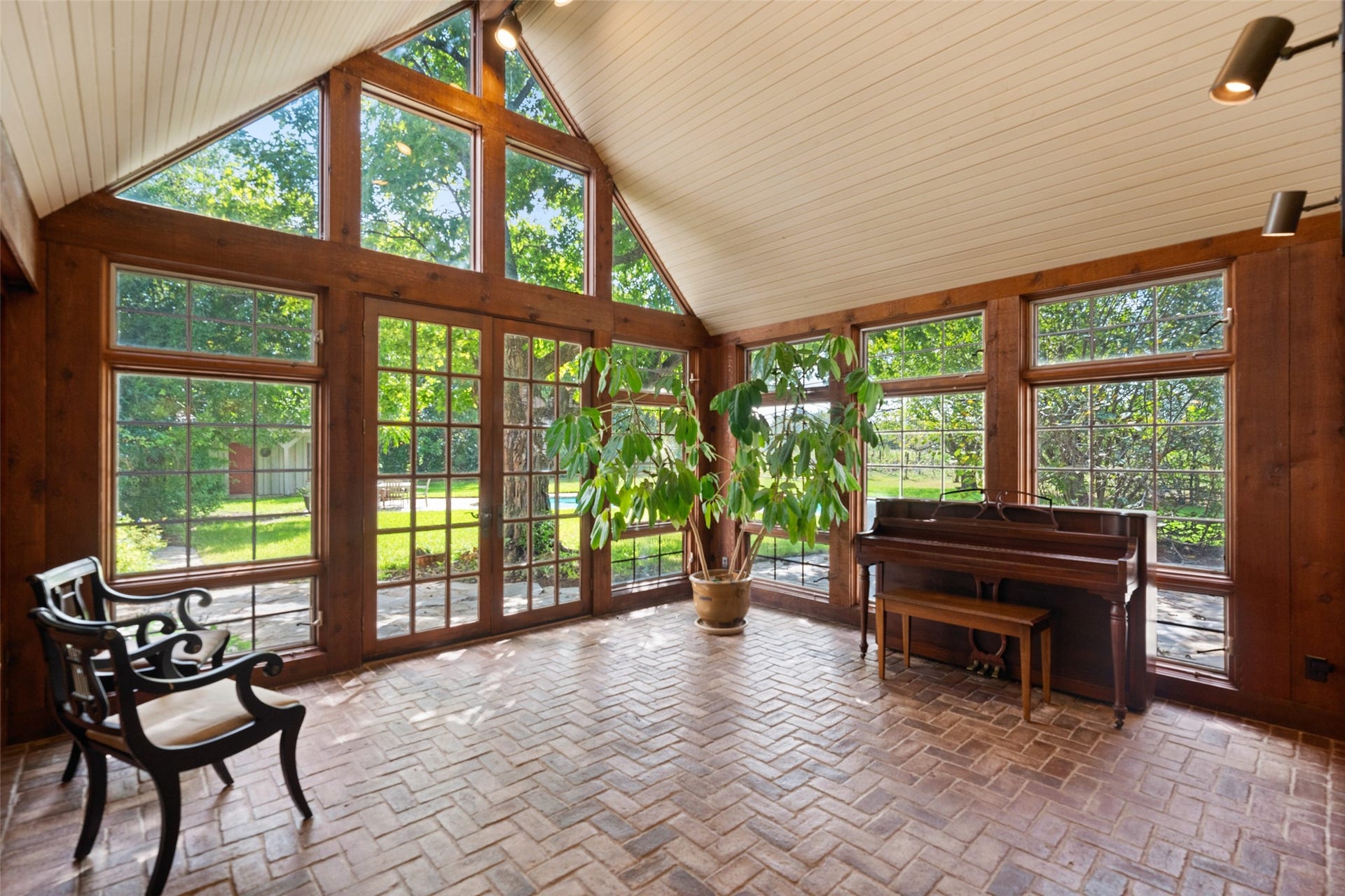 38914 Sampson Road, Brookshire, TX 77423 Cathedral ceilings crown this picturesque sunroom just off the kitchen with a back door that has long served as the homes favorite entrance for welcoming guests.