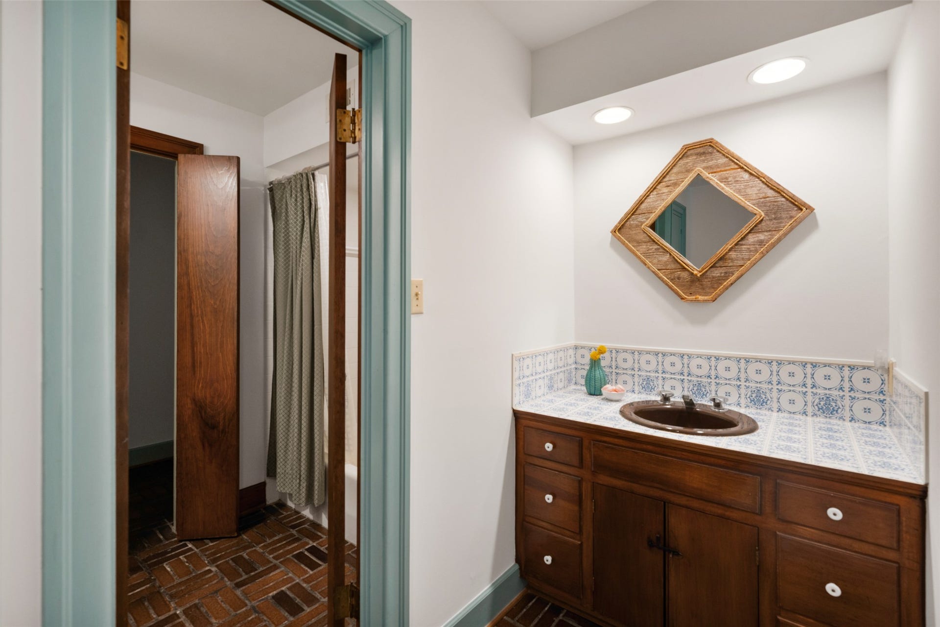 38914 Sampson Road, Brookshire, TX 77423 A charming Jack-and-Jill bath where each vanity brings its own personality and character to the shared space.