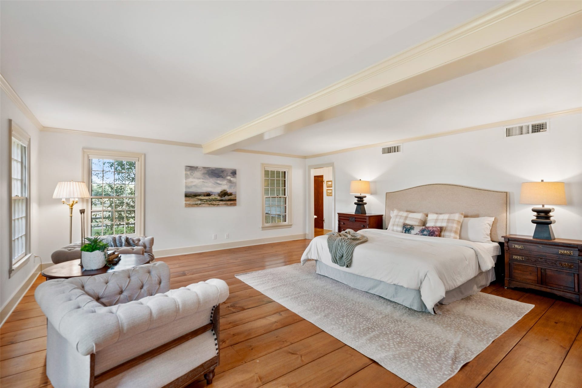 38914 Sampson Road, Brookshire, TX 77423 The first-floor primary suite continues the homes timeless character with beautiful wide-plank Eastern Pine floors.