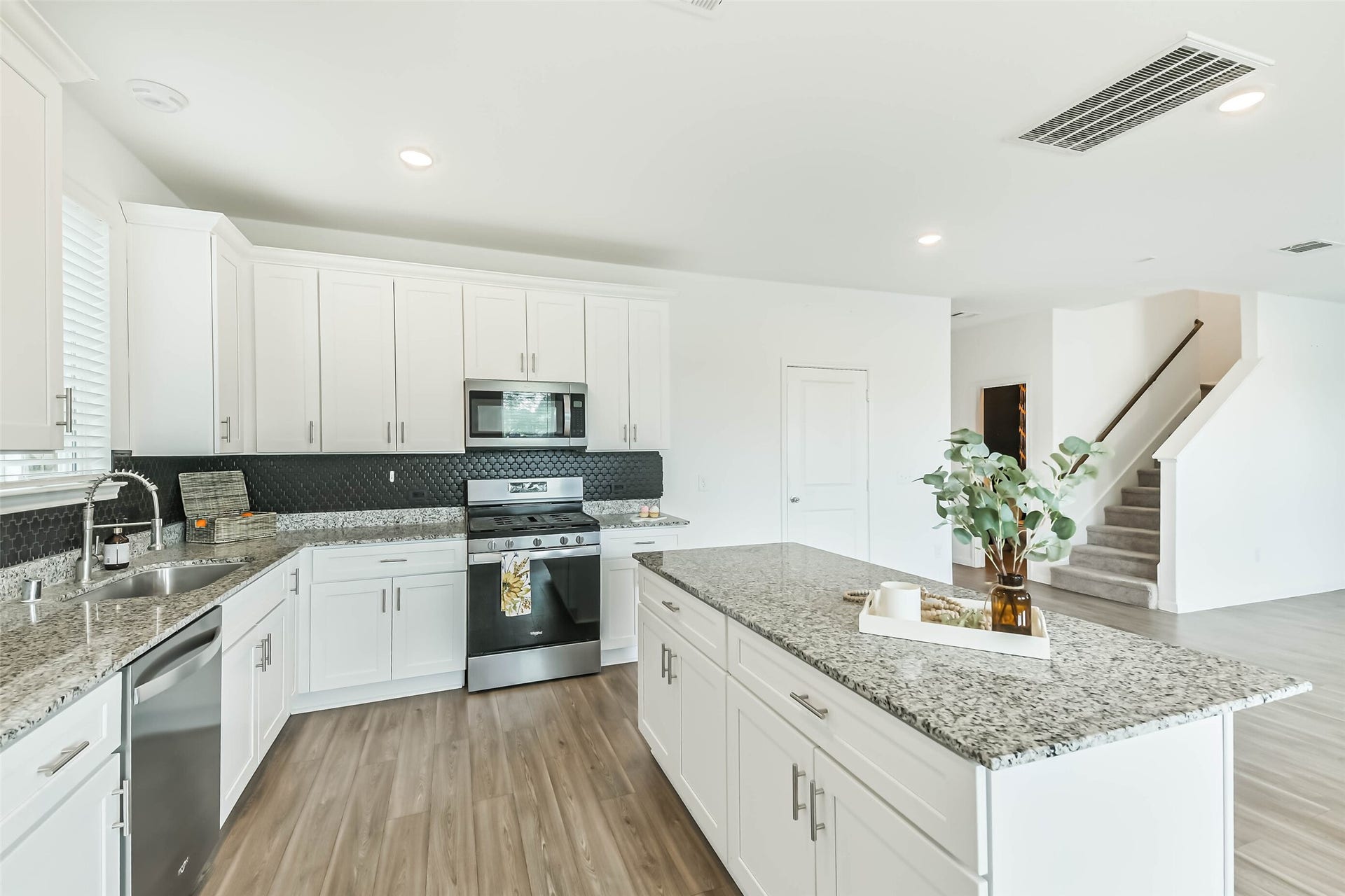 25631 Balsamroot Drive, Magnolia, TX 77355 Granite counters and tile backsplash are gorgeous in the kitchen.