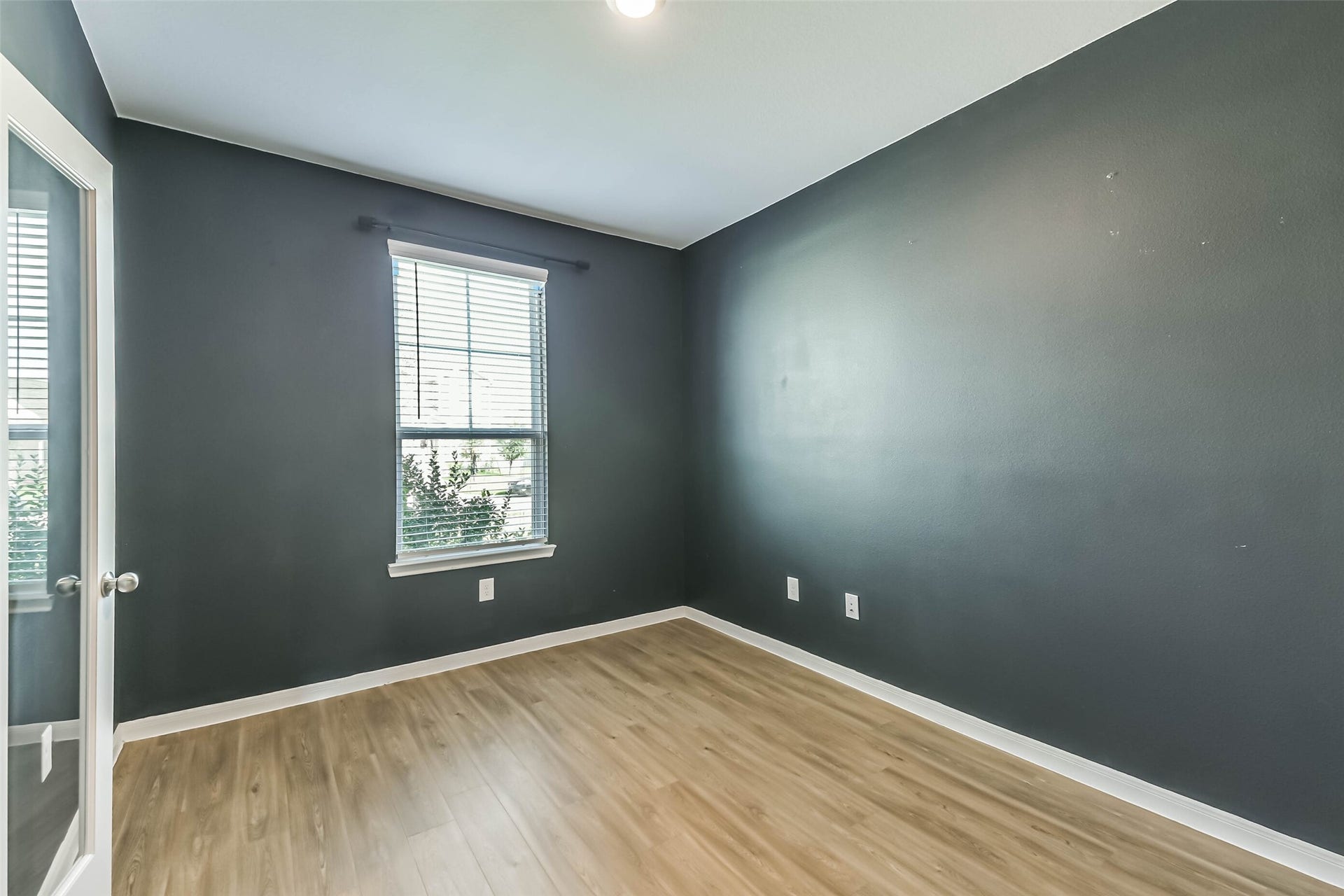 25631 Balsamroot Drive, Magnolia, TX 77355 A tailored study featuring deep tones.