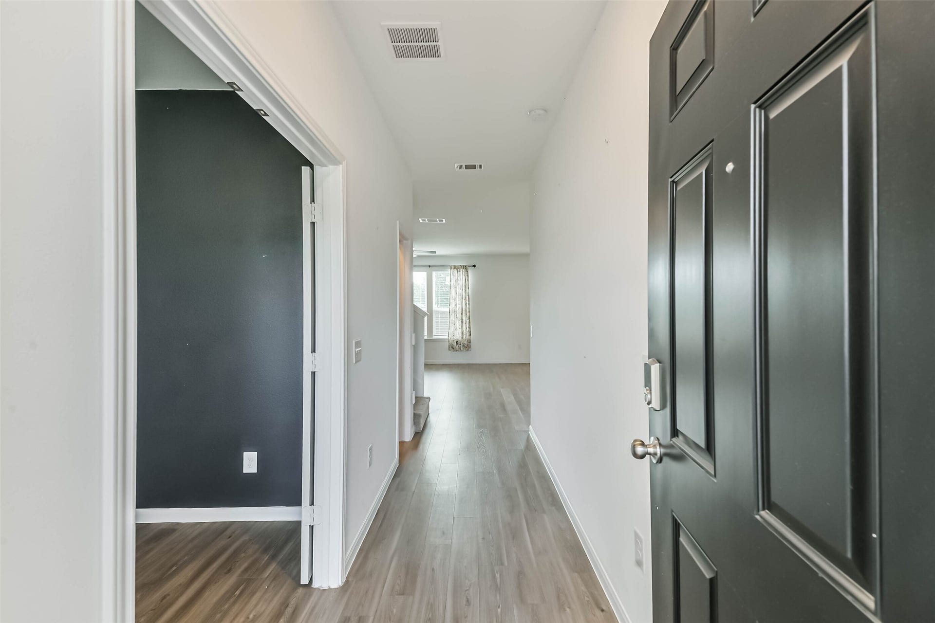 25631 Balsamroot Drive, Magnolia, TX 77355 Foyer and study greet you with stylish flooring throughout the downstairs living areas.
