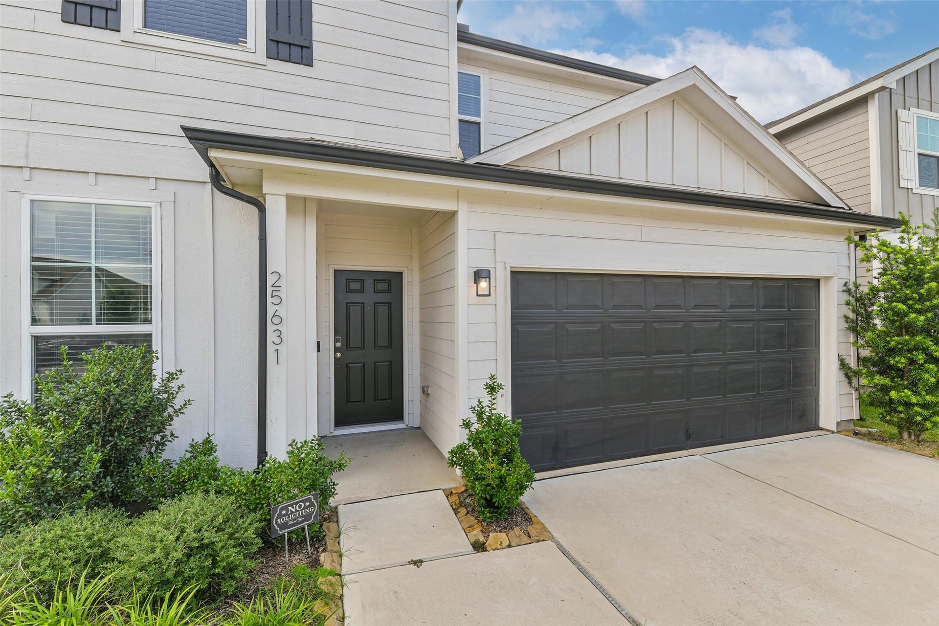 25631 Balsamroot Drive, Magnolia, TX 77355 Established flower beds and clean lines welcome you home!