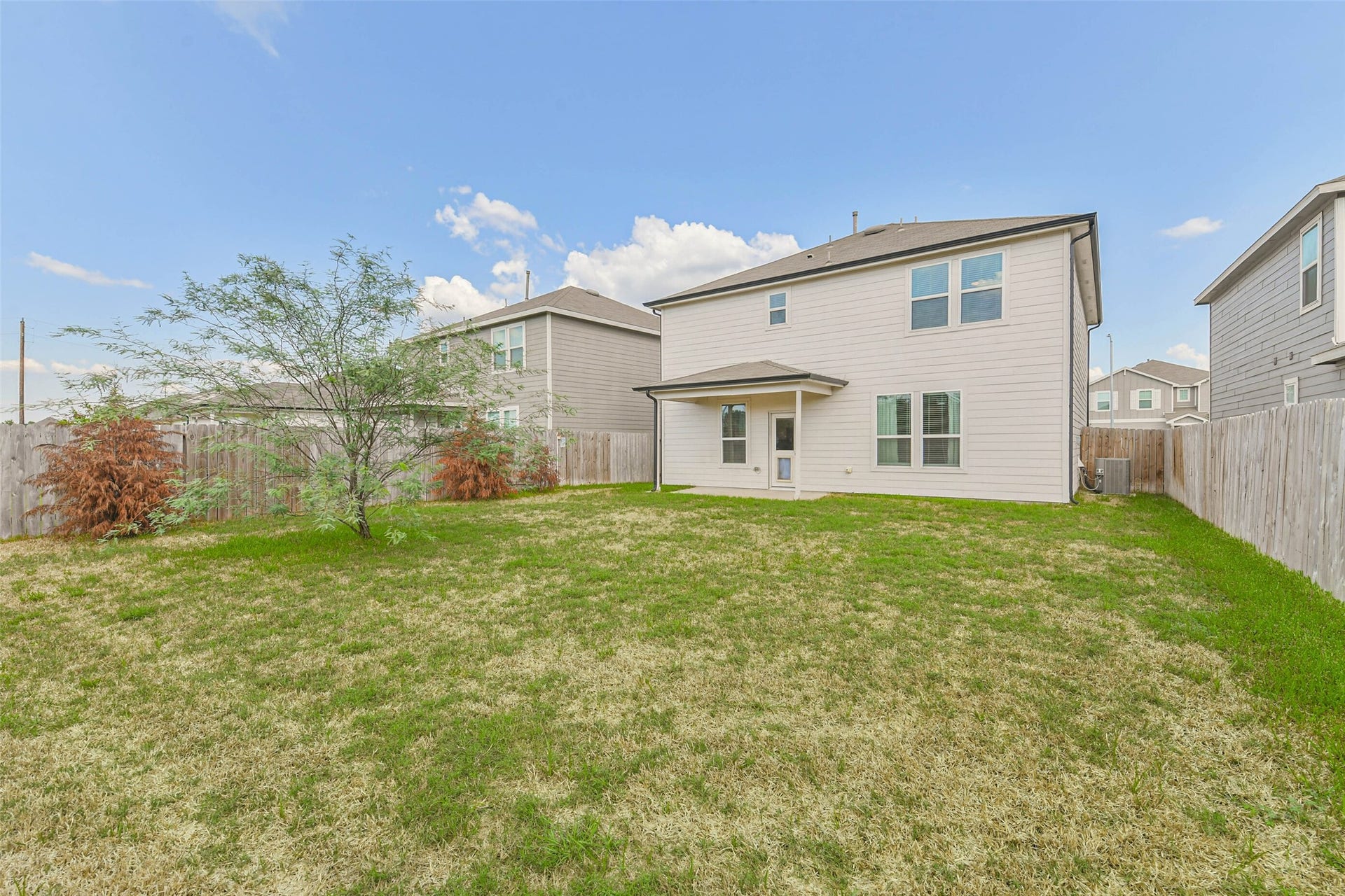 25631 Balsamroot Drive, Magnolia, TX 77355 The back of the house with covered porch.