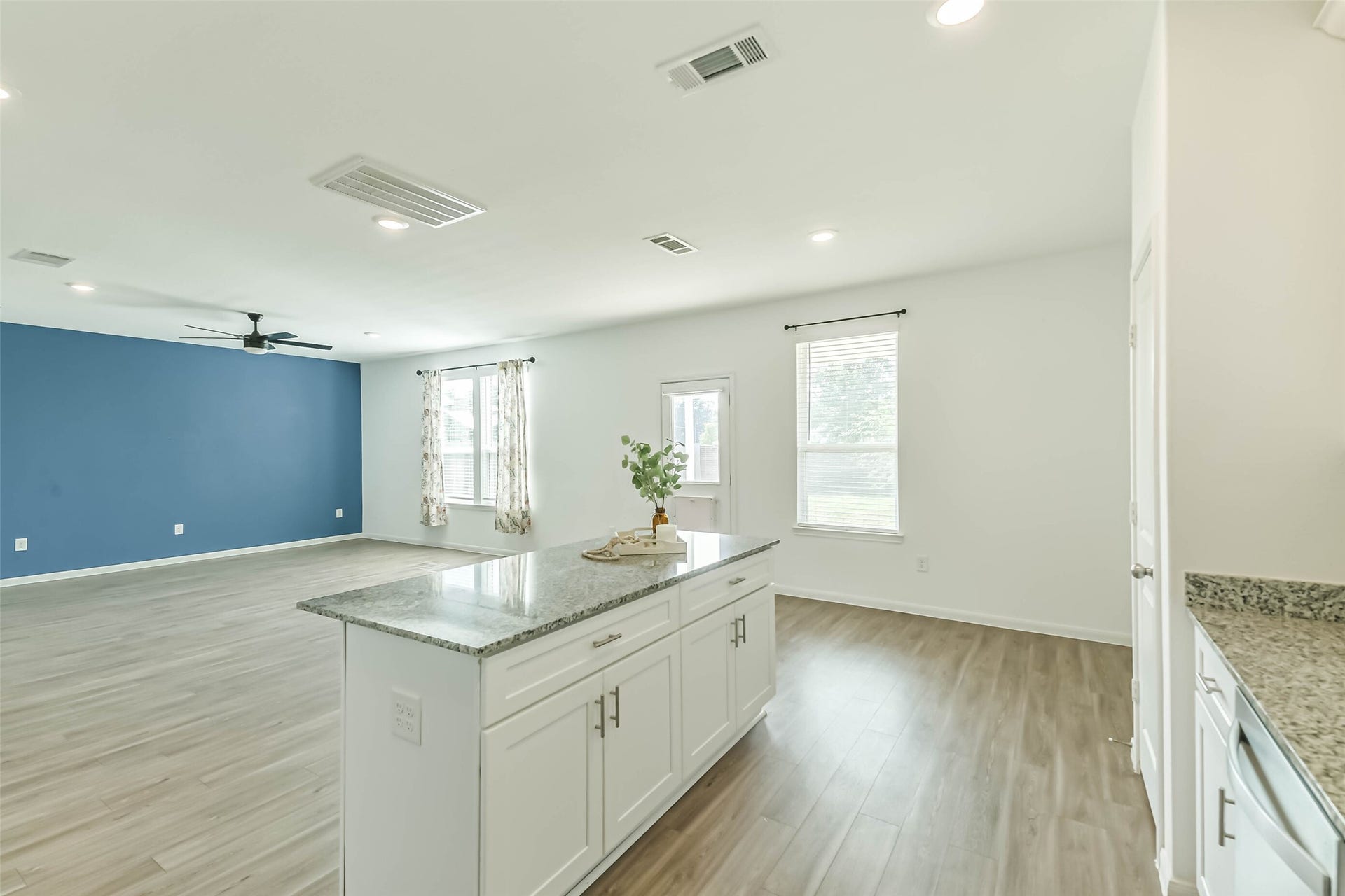 25631 Balsamroot Drive, Magnolia, TX 77355 The windows on the back of the house bring in lots of natural light in addition to the recessed lighting.
