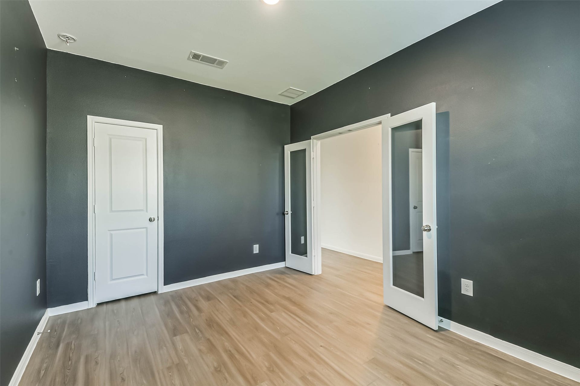 25631 Balsamroot Drive, Magnolia, TX 77355 French doors open to the study and the closet wraps under the stairs for maximum storage.