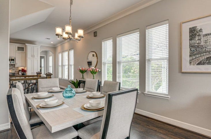1013 10th Street, Galveston, TX 77550 Elegantly appointed dining area, bathed in natural light, with stylish furnishings included.