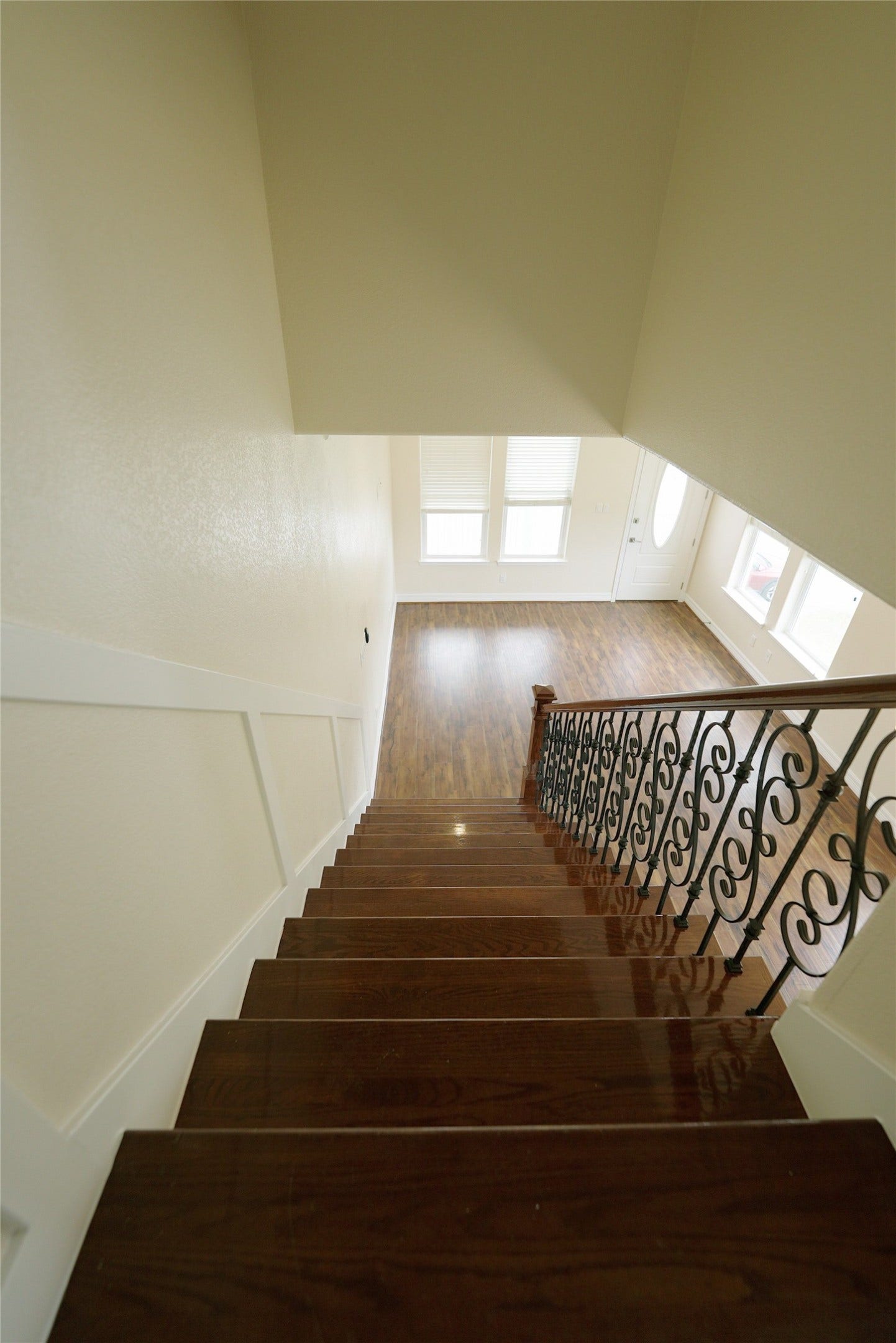 1013 10th Street, Galveston, TX 77550 Elegant iron railing graces the staircase, leading down to the spacious second level.