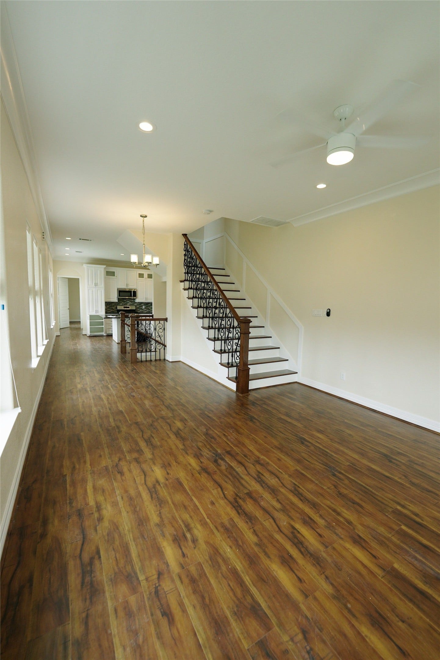 1013 10th Street, Galveston, TX 77550 Spacious open living area featuring stunning hardwood floors, currently tenant-occupied.