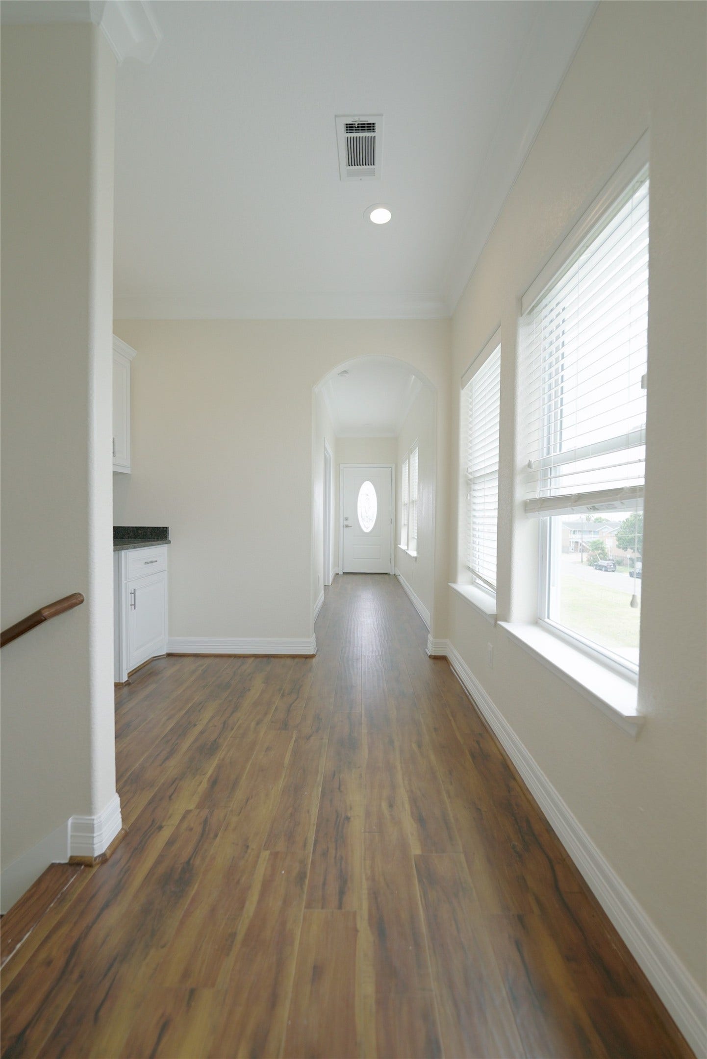 1013 10th Street, Galveston, TX 77550 Top-level hallway featuring stunning hardwood floors, currently tenant-occupied.