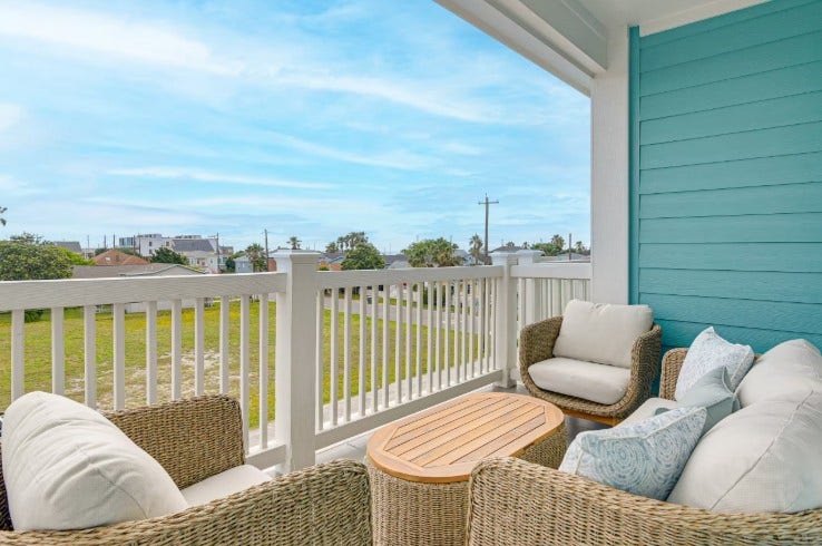 1013 10th Street, Galveston, TX 77550 Charming second-floor balcony at 1013 10th A, fully furnished for your comfort and relaxation.