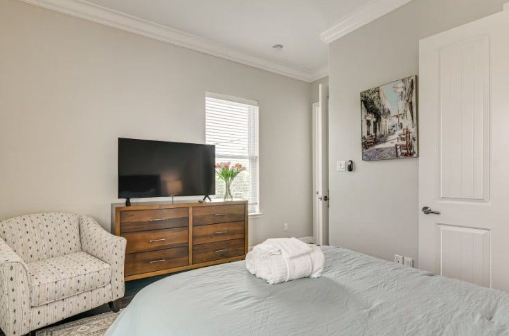 1013 10th Street, Galveston, TX 77550 Charming guest bedroom, fully furnished and ready for comfort and relaxation.
