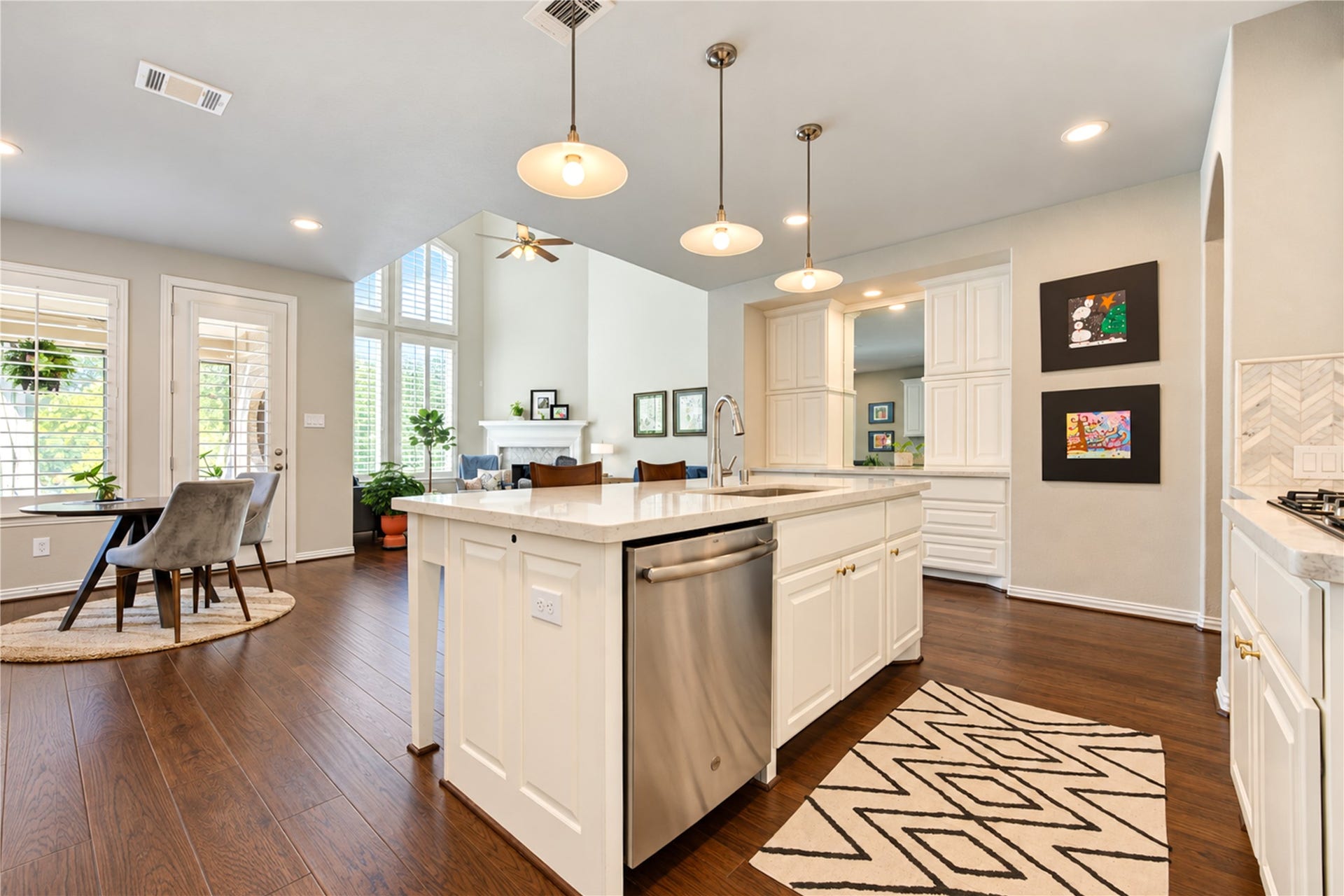 Abundant windows fill the home with natural light, creating a bright, airy atmosphere that flows effortlessly throughout the living spaces.