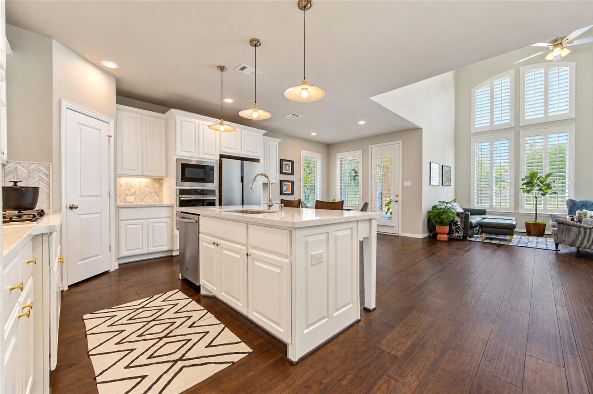 The open-concept floor plan is ideal for entertaining, with the kitchen flowing seamlessly into the family room and breakfast area to create a welcoming space for gathering with family and friends.