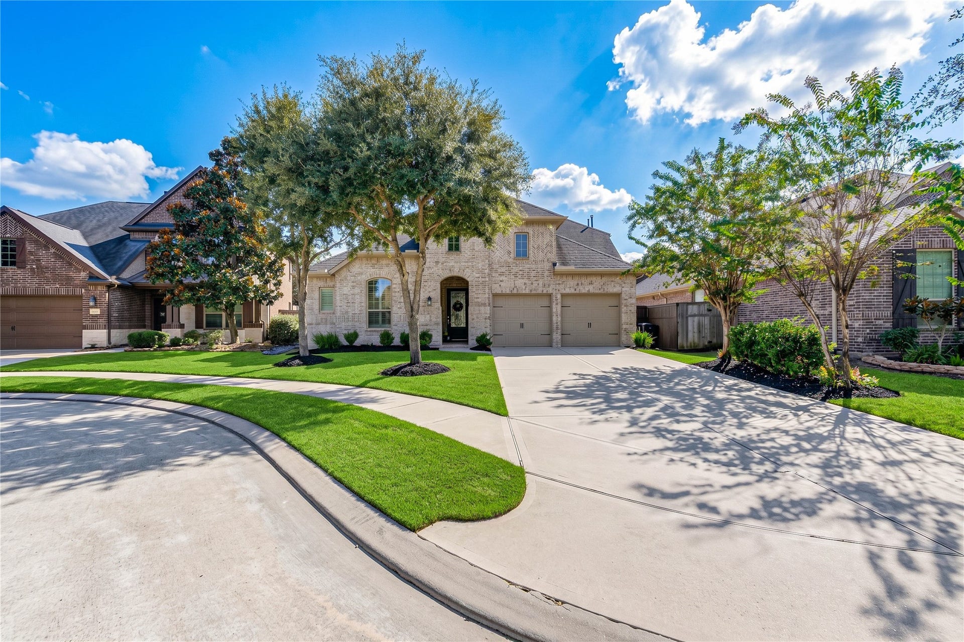 The homes striking brick surround creates a grand, welcoming first impression, complemented by a two-car garage and a desirable cul-de-sac location.