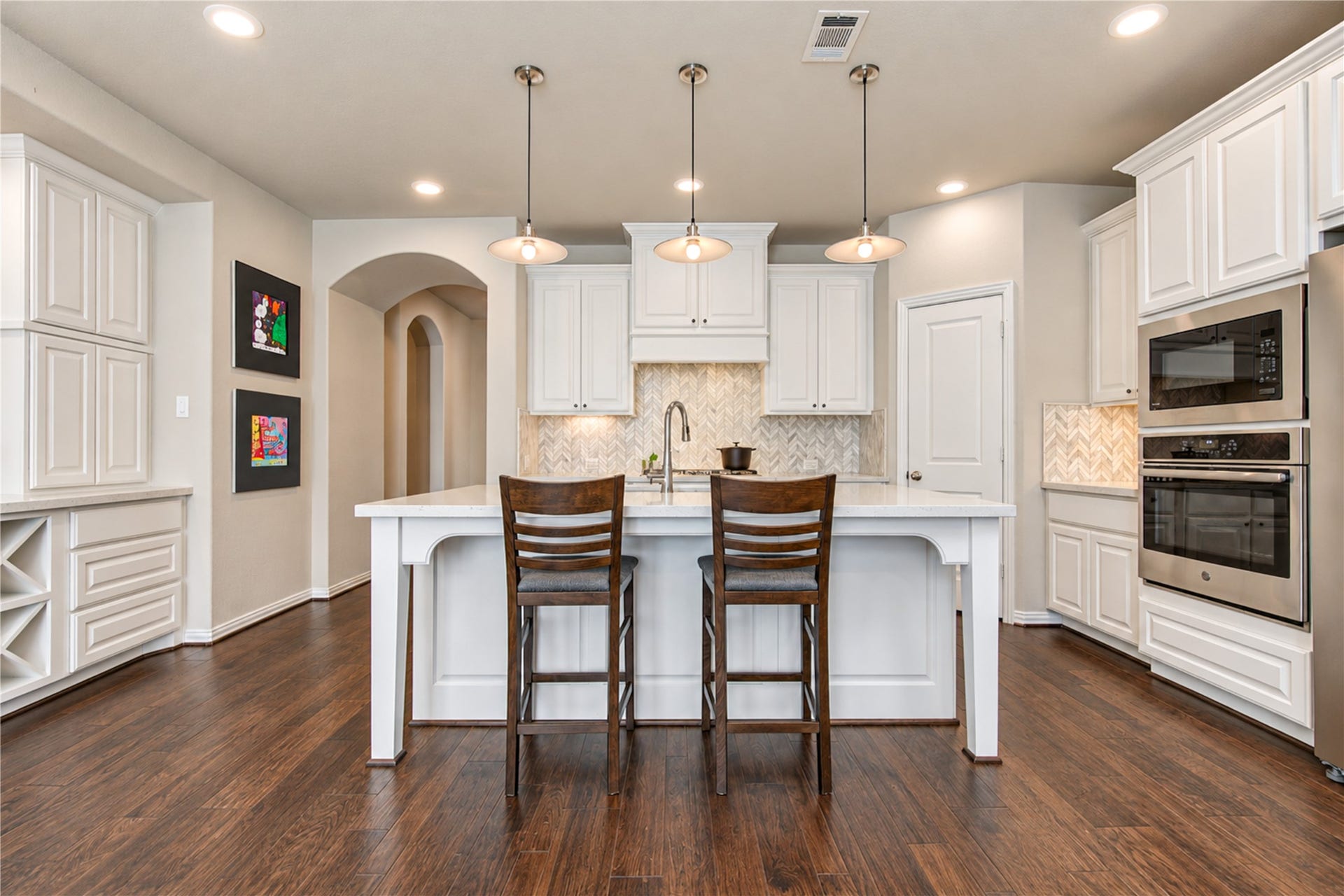 Abundant windows fill the home with natural light, creating a bright, airy atmosphere that flows effortlessly throughout the living spaces.