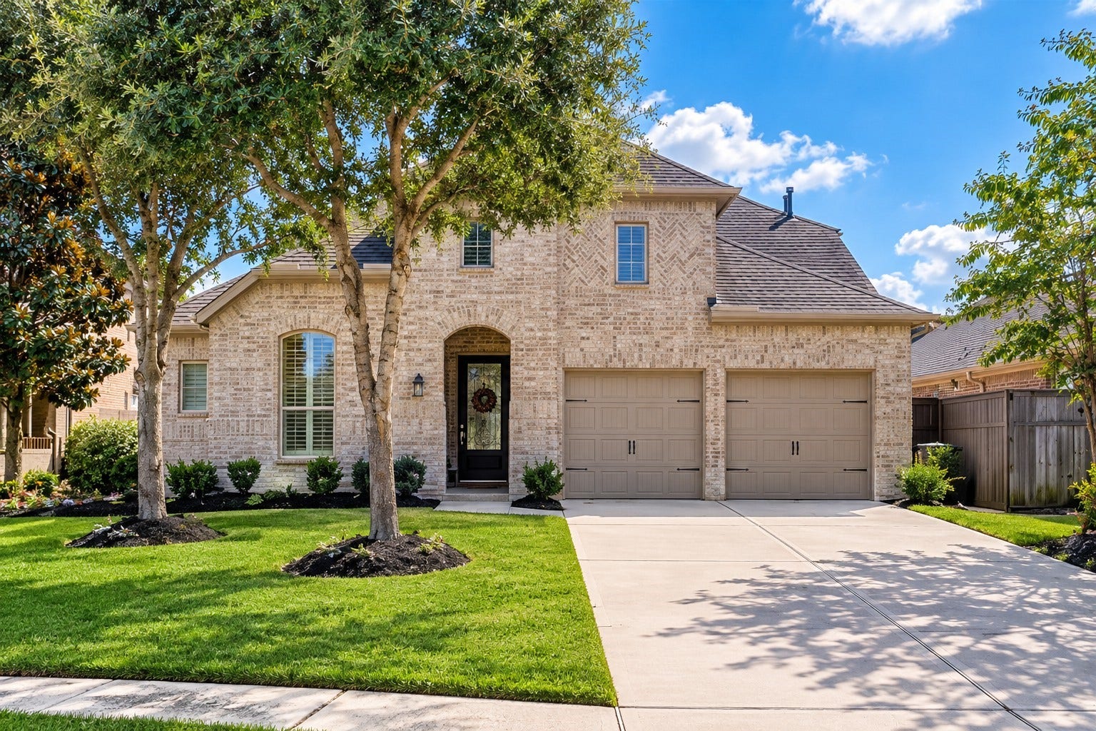 27411 Grayson Gap Ct, Fulshear, TX 77441 The homes striking brick surround creates a grand, welcoming first impression, complemented by a two-car garage and a desirable cul-de-sac location.