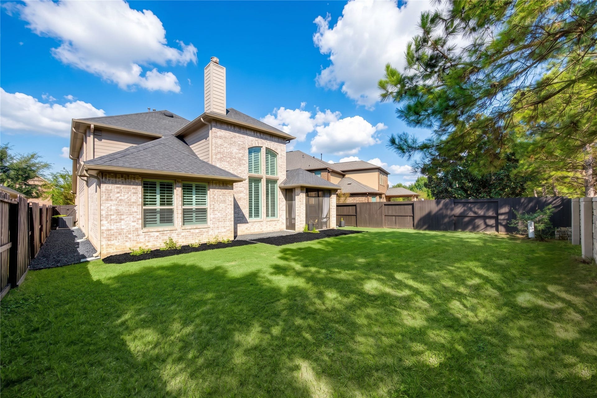 The spacious backyard offers plenty of room to create your ideal outdoor retreat, with space for a future pool, trampoline, fire pit, and more!