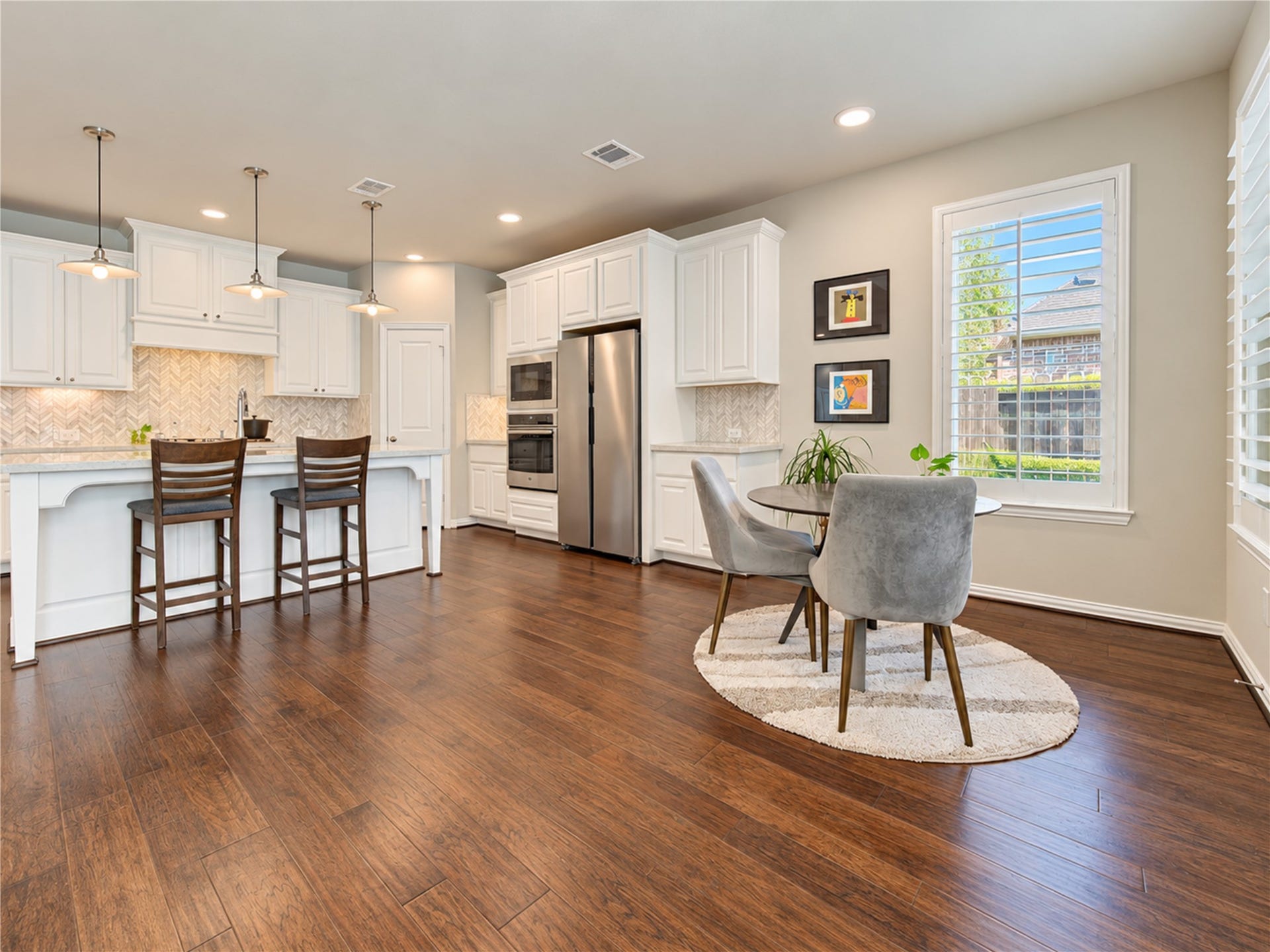 Abundant windows fill the home with natural light, creating a bright, airy atmosphere that flows effortlessly throughout the living spaces.