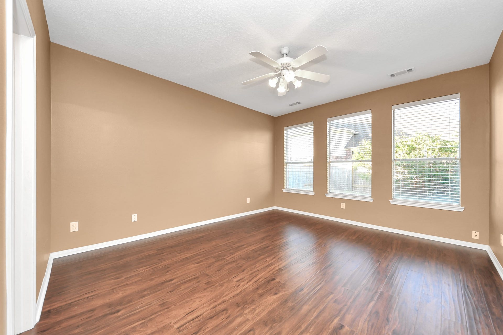Spacious primary bedroom with lots of light