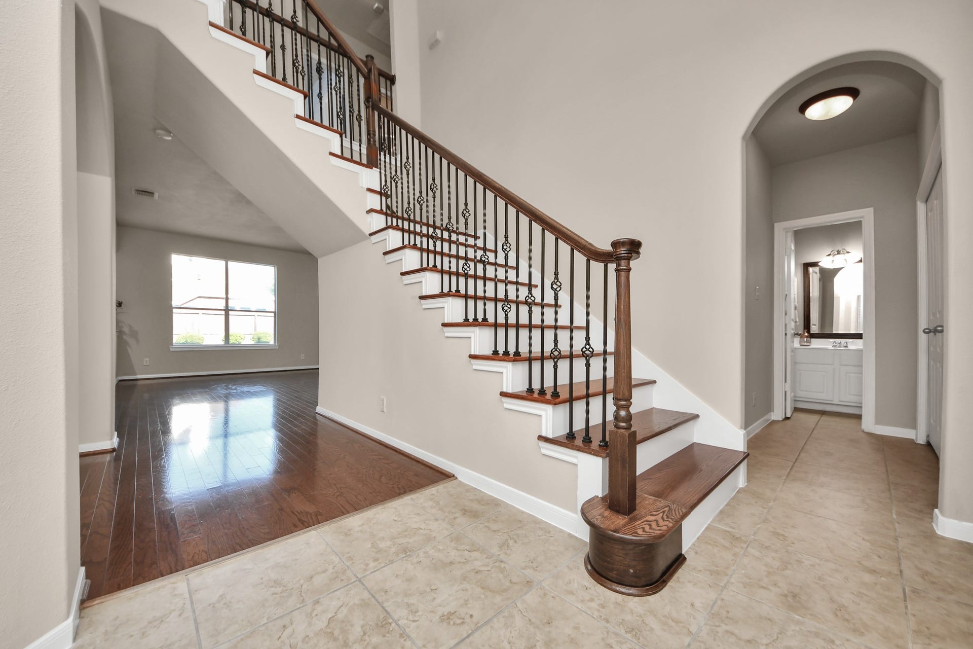 17418 Memorial Mills Drive, Spring, TX 77379 To the right of the staircase you will find the laundry room, a generous storage closet, garage access, a bedroom and full bath.