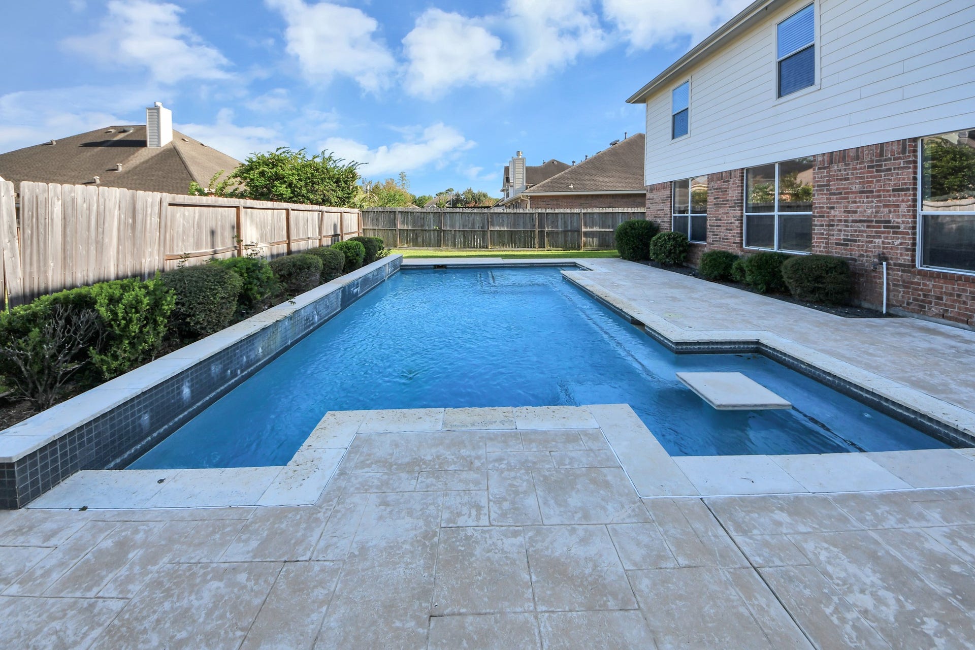 17418 Memorial Mills Drive, Spring, TX 77379 The beautiful saltwater pool has stunning water features and a built-in table and bar area, perfect for relaxing or entertaining friends and family!