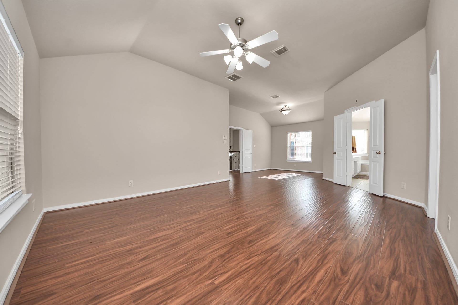 17418 Memorial Mills Drive, Spring, TX 77379 The spacious primary bedroom includes two walk-in closets and is positioned away from the other bedrooms to provide added privacy.