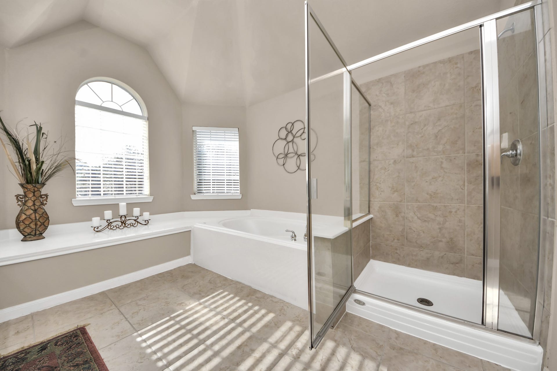 17418 Memorial Mills Drive, Spring, TX 77379 The primary bathroom offers a spa-like retreat, featuring a spacious walk-in shower and a luxurious soaking tub.