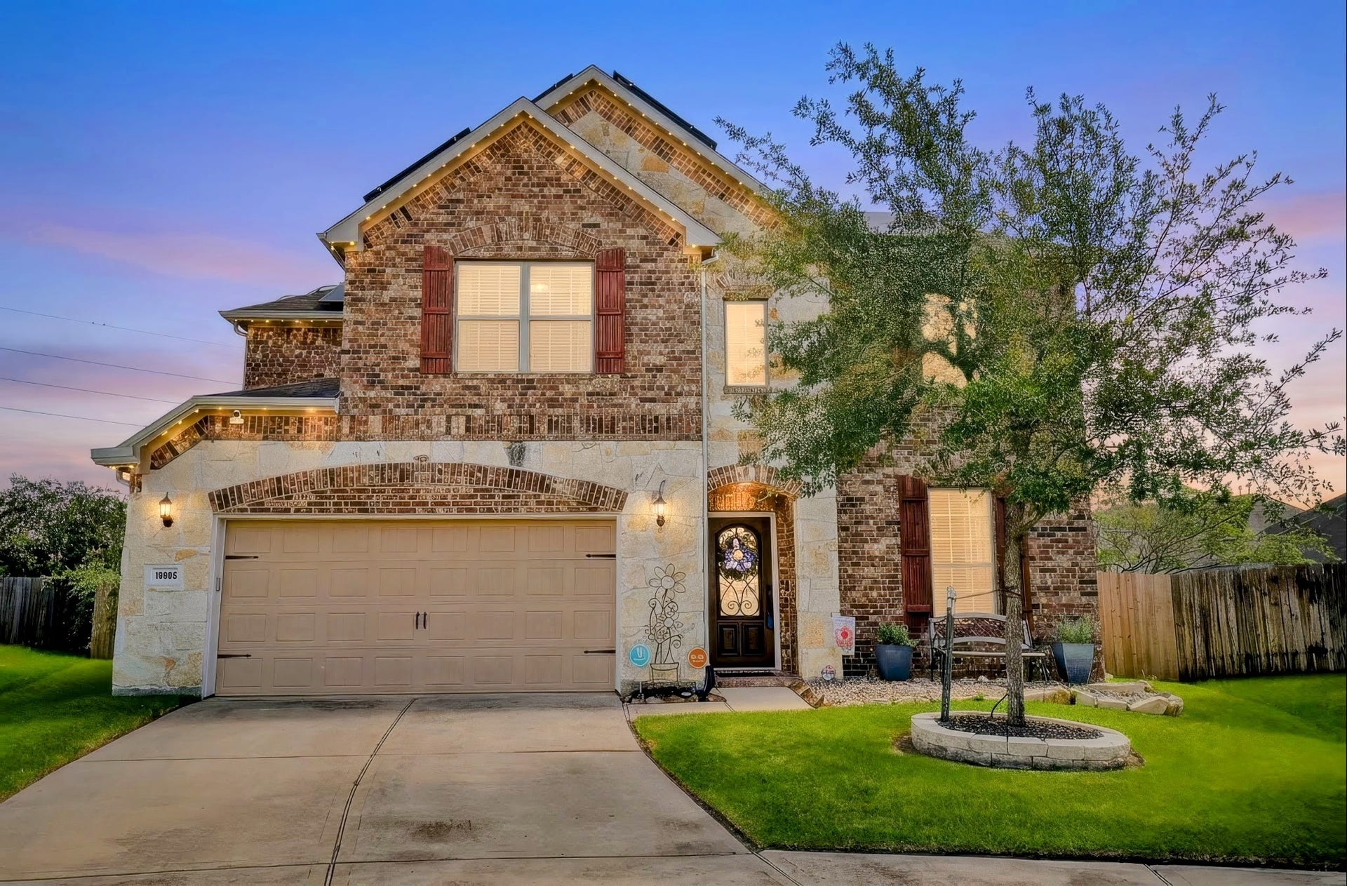19802 Mulberry Pine Lane, Cypress, TX 77429 The front of the home with permanently installed Jellyfish lighting that are fully adjustable. The home also features an over-sized garage with a workspace.