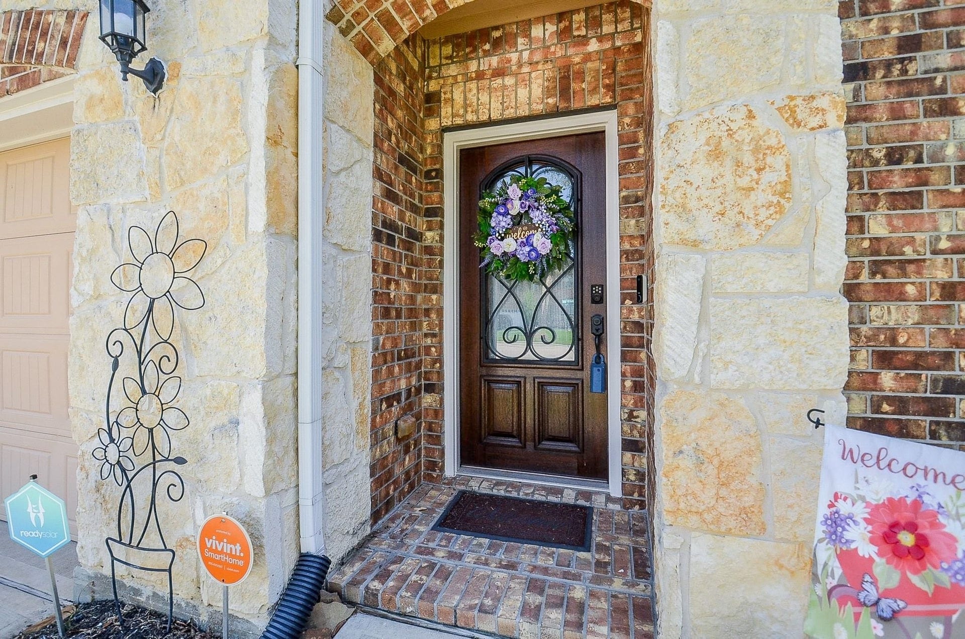 19802 Mulberry Pine Lane, Cypress, TX 77429 Gorgeous entry to the home with Austin Stone and a newly refinished front door complete with a glass panel and decorate wrought iron.