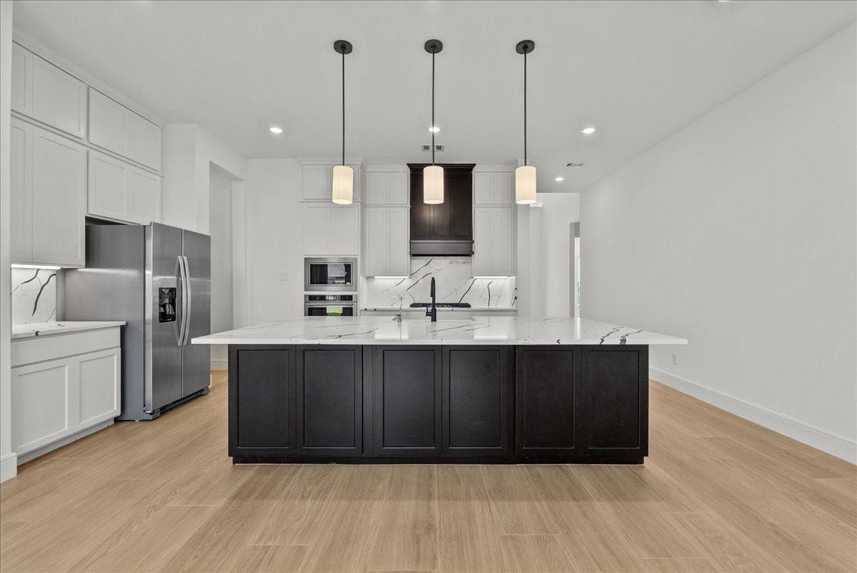 3013 Shelly Bayou Court, League City, TX 77573 Chefs eat-in island Kitchen features lengthy quartz countertops