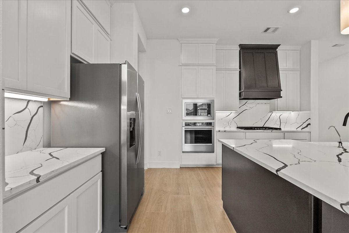 3013 Shelly Bayou Court, League City, TX 77573 Chefs eat-in island Kitchen features lengthy quartz countertops