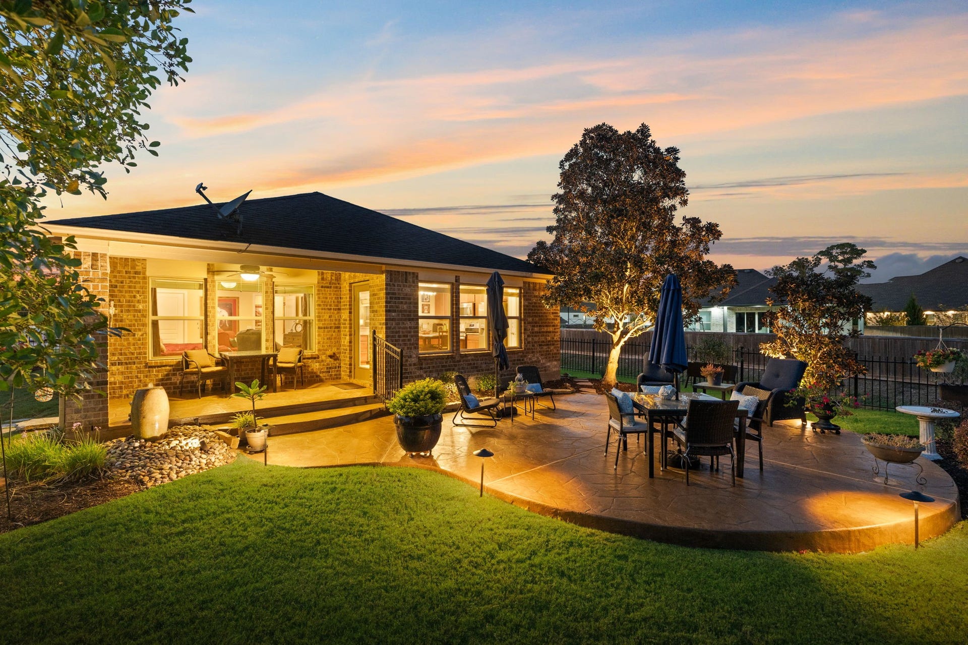2903 Bur Oak Court, Richmond, TX 77469 Lush greenery creates a sense of seclusion, making this backyard feel worlds away.