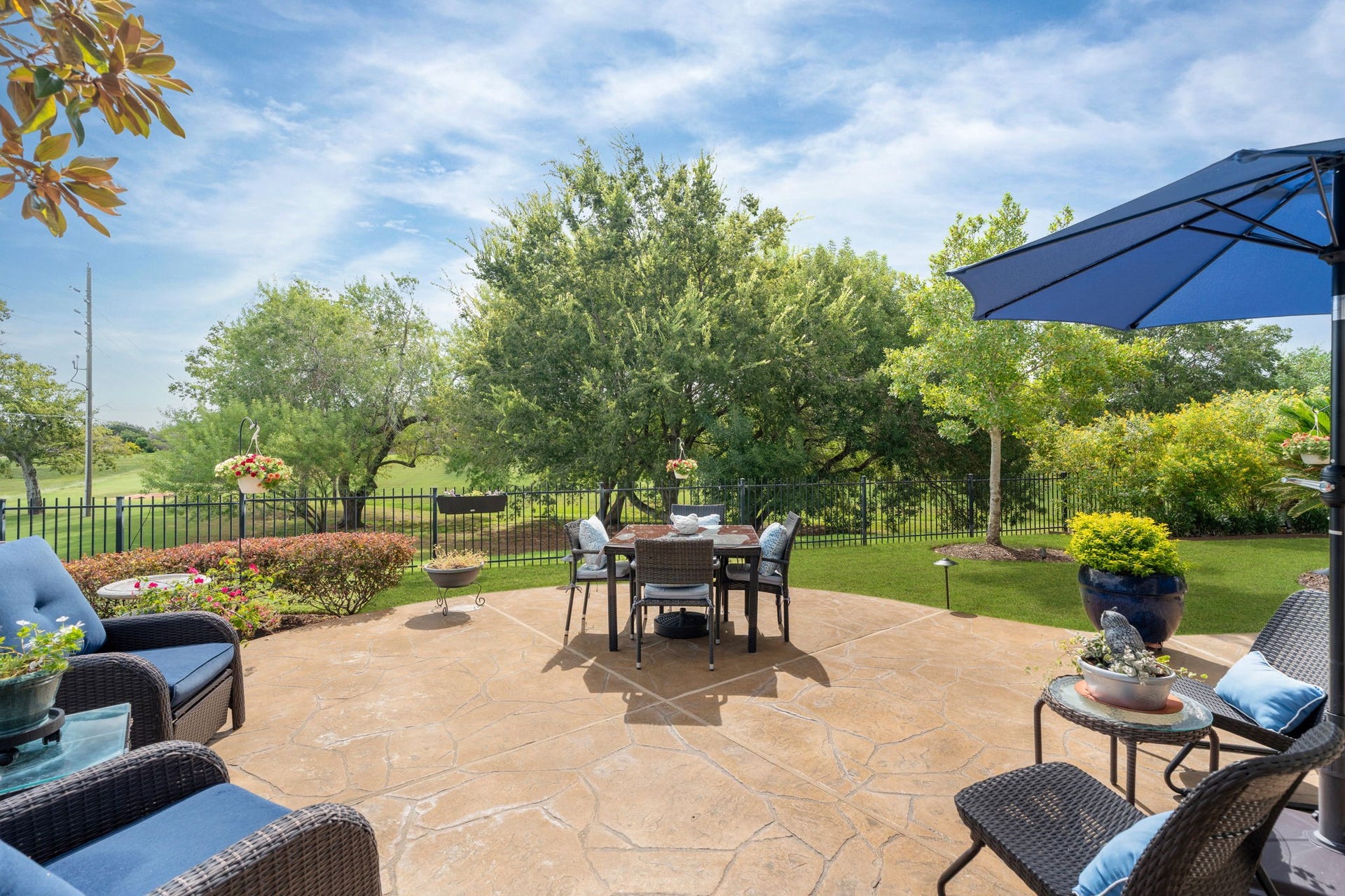 2903 Bur Oak Court, Richmond, TX 77469 A place where hummingbirds dance among blossoms & every season brings something beautiful. More than a backyard, it's an experience! A remarkable combination of privacy, gardens, fountain & wooded views.