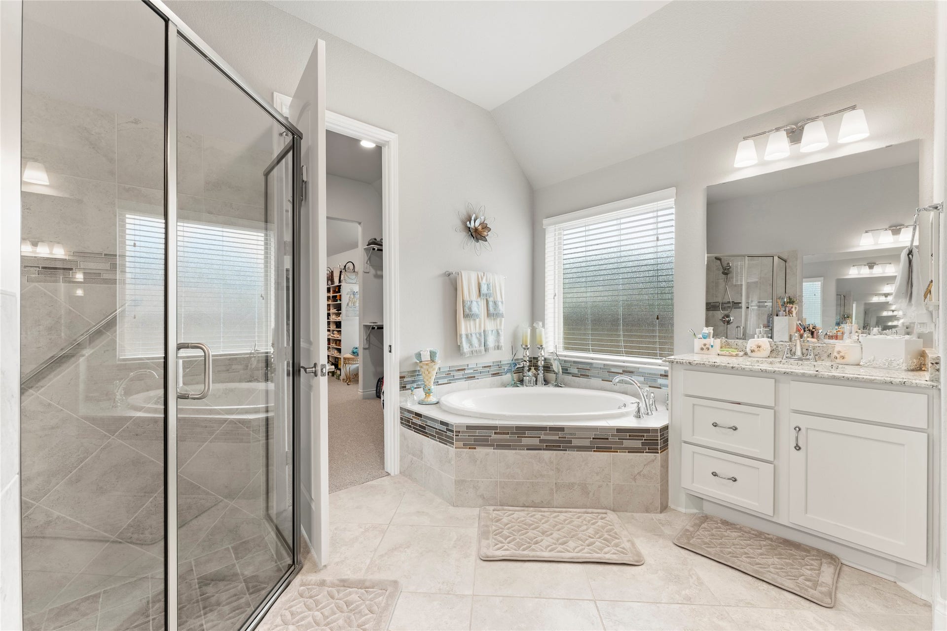 28155 Briarwood Pass, Spring, TX 77386 Luxurious master bathroom featuring bathtub, shower, adn dual vanities.