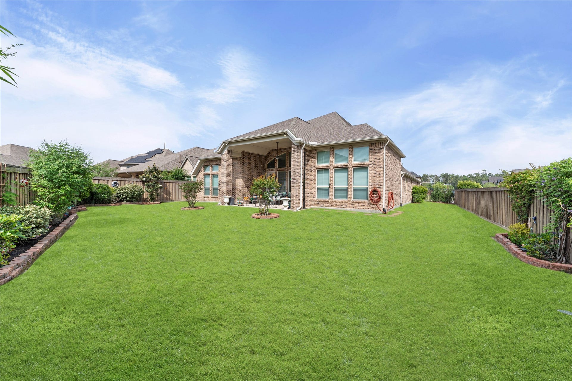 28155 Briarwood Pass, Spring, TX 77386 Spectacular view of the house and surrounding landscaping from the corner.