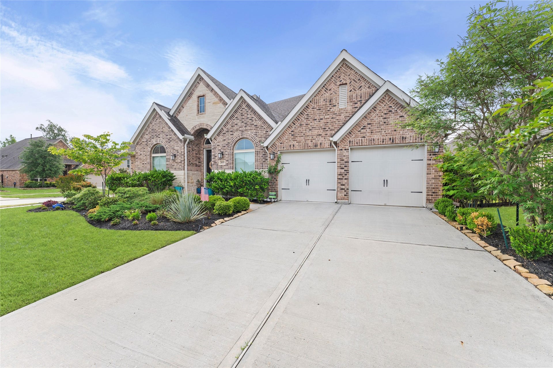 28155 Briarwood Pass, Spring, TX 77386 Front exterior with driveway leading to the garage.