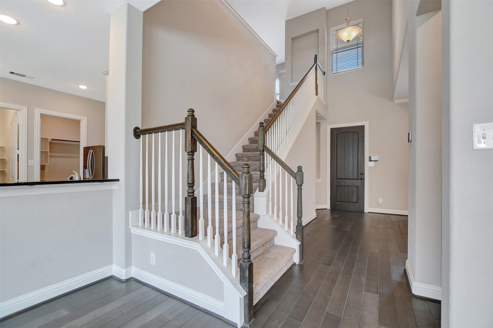 Side stairs take you to all bedrooms and gameroom.