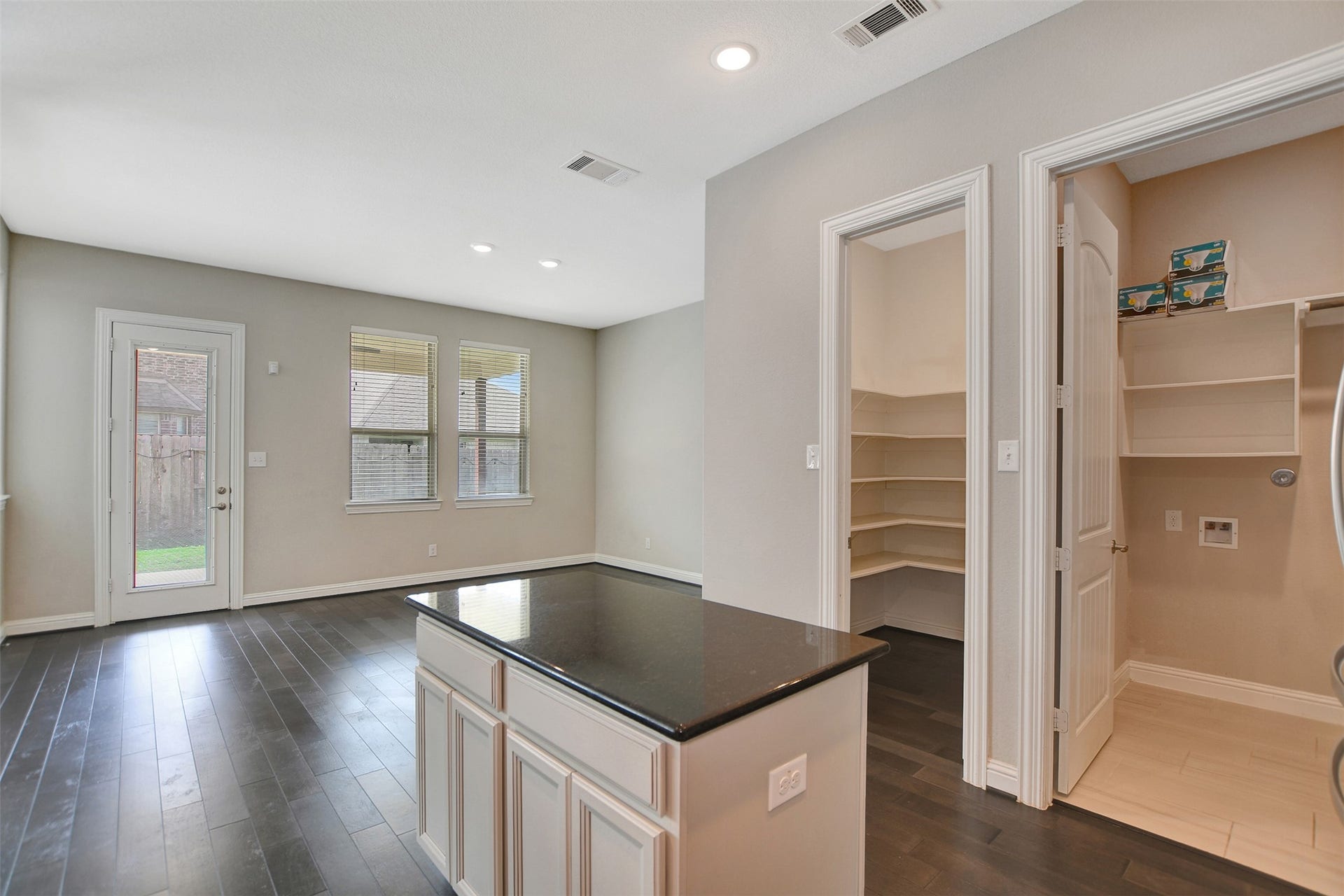 Large walk-in pantry to the side of the kitchen and Laundy area.
