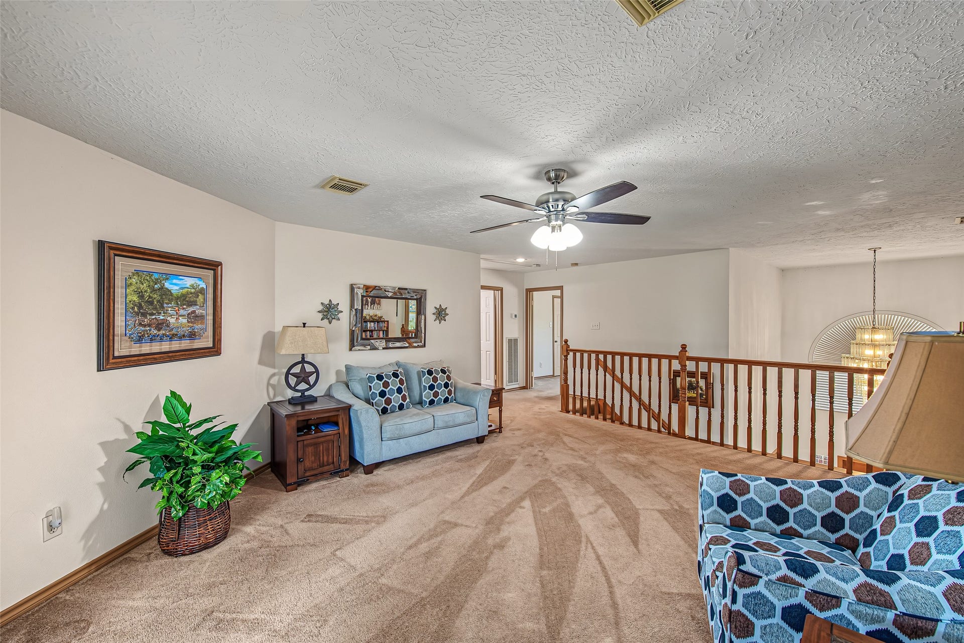 1345 Peach Ridge Road, Brookshire, TX 77423 Soft plush carpeting underfoot creates a warm, comfortable ambiance, while recessed lighting and a central ceiling fan keep the room bright and airy.