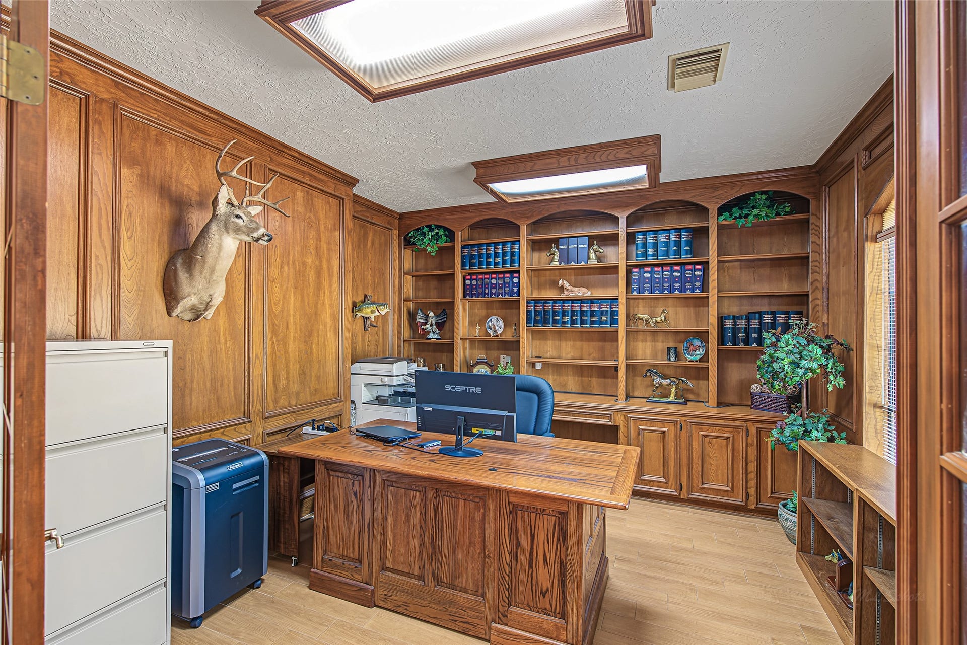 1345 Peach Ridge Road, Brookshire, TX 77423 This private study is highlighted by floor-to-ceiling custom wood paneling and detailed trim, this room exudes timeless executive style.