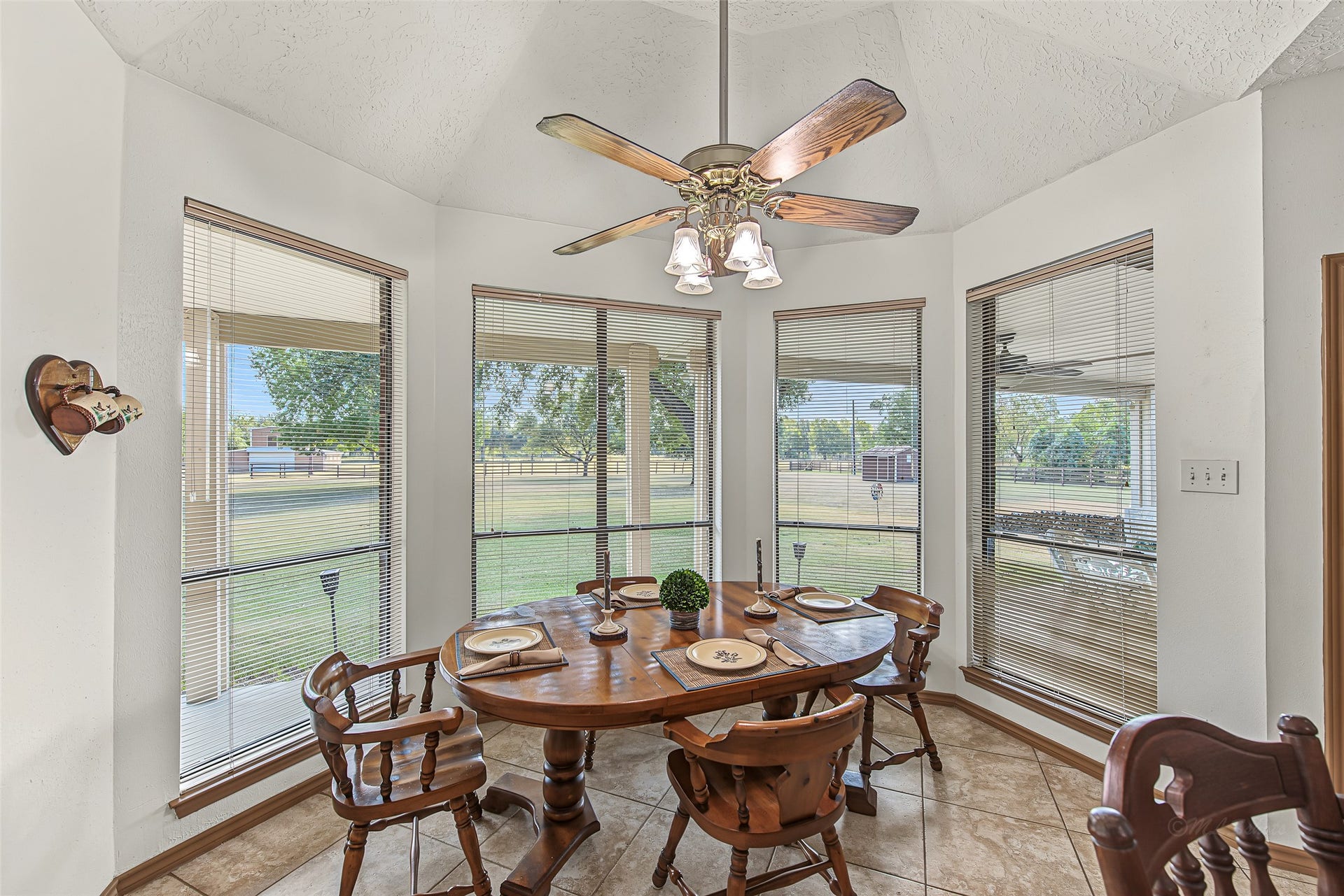 1345 Peach Ridge Road, Brookshire, TX 77423 You will love how effortlessly this casual dining space flows to the outdoors, offering picturesque views of the grounds and a multi-pane glass door that opens directly onto the covered patio.