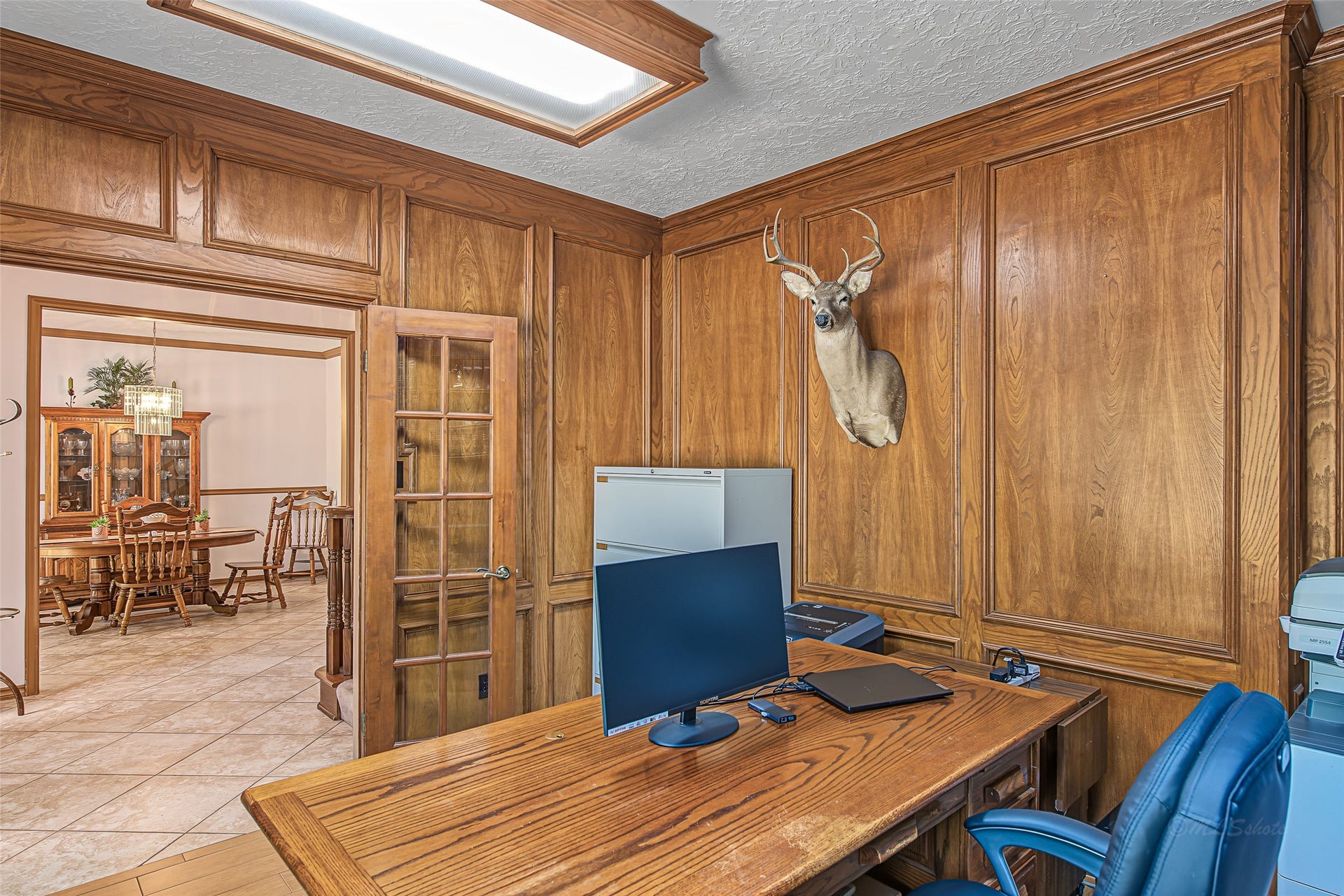 1345 Peach Ridge Road, Brookshire, TX 77423 Combining classic Texas heritage warmth with double entry French doors, this versatile room offers buyers the perfect blend of luxury, quiet privacy, and turnkey utility for a primary office or personal library.