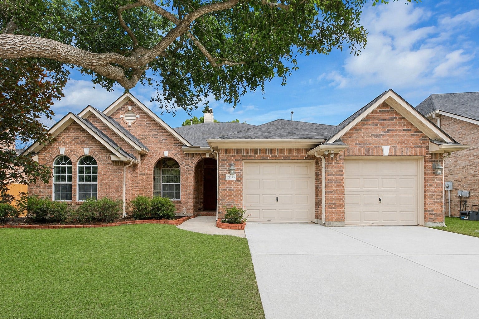 21123 Dover Park Lane, Katy, TX 77450 This charming brick home features a well-maintained lawn, two-car garage, and inviting arched windows. The mature tree offers shade and enhances curb appeal. Ideal for families seeking a cozy and welcoming environment.
