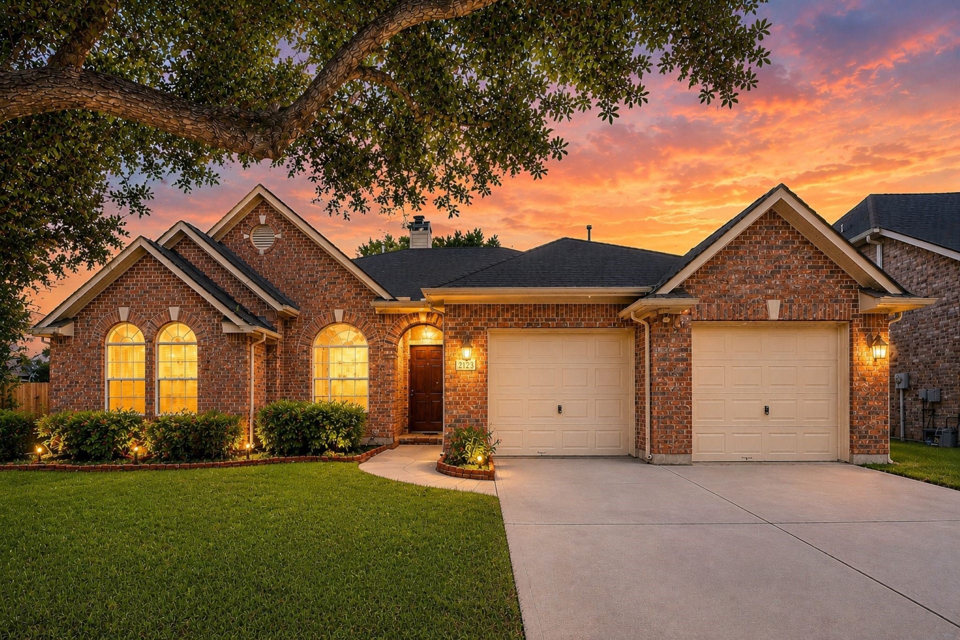21123 Dover Park Lane, Katy, TX 77450 VIRTUALLY STAGED!
This charming brick home features a well-maintained lawn, a two-car garage, and warmly lit arched windows. The sunset backdrop and mature tree add to the inviting curb appeal.